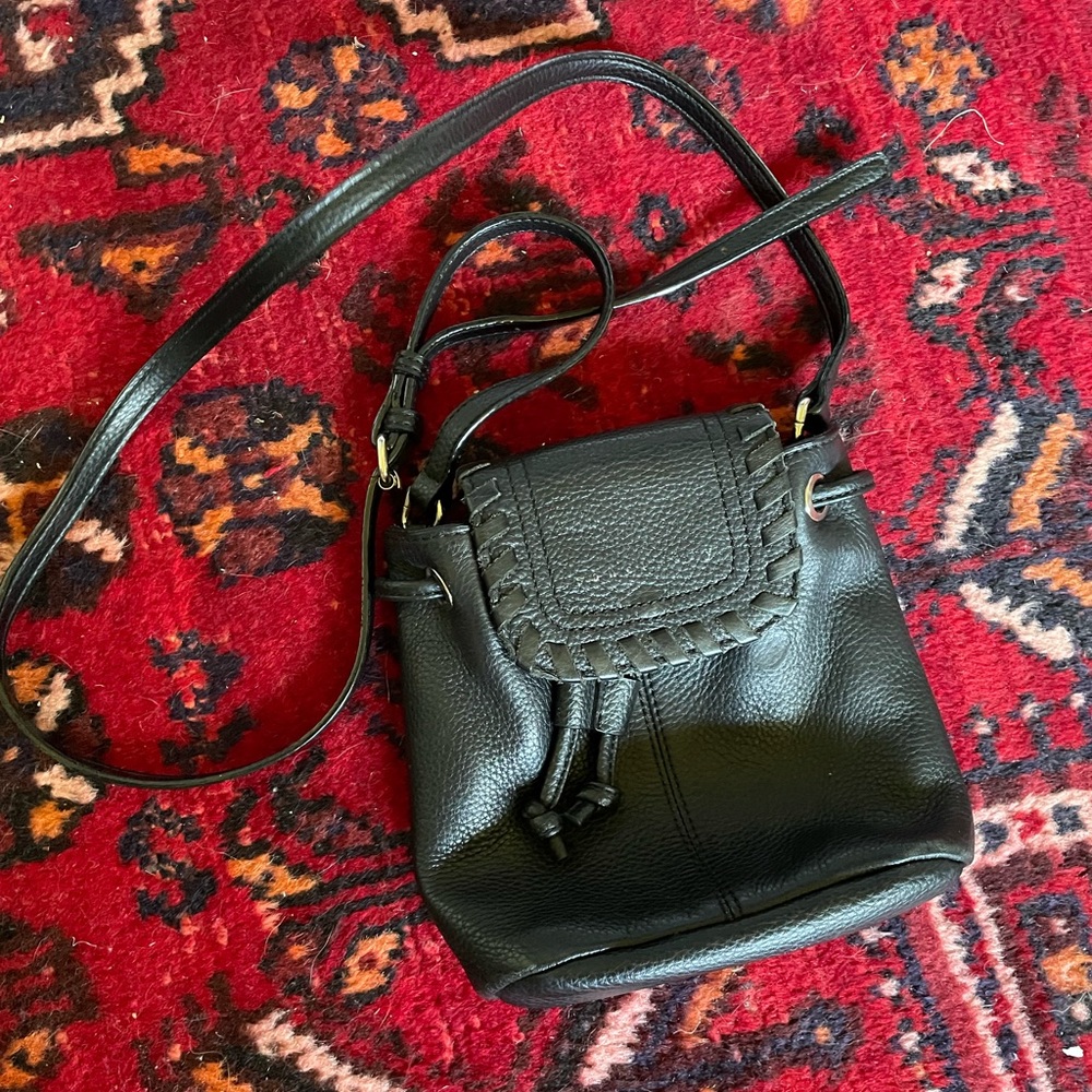 Small black leather pouch purse.